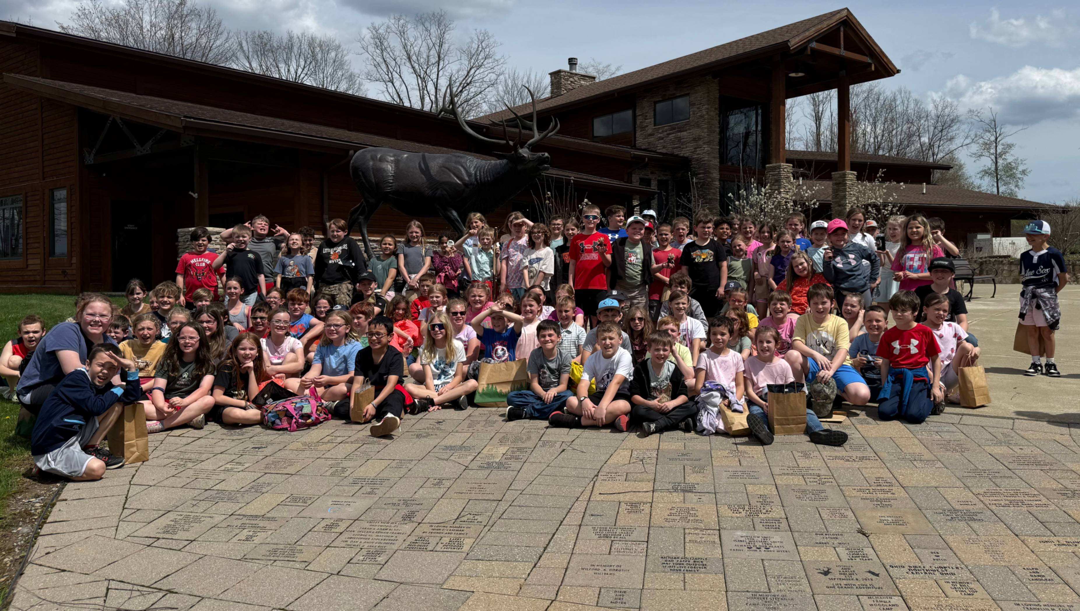 The third grade class gathers for a group photo in front of the Elk Country Visitors Center.